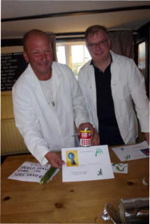 Judges Andy Shillingford and Major Tim Peacocke display the winning entry in the 'Best Cheat' category